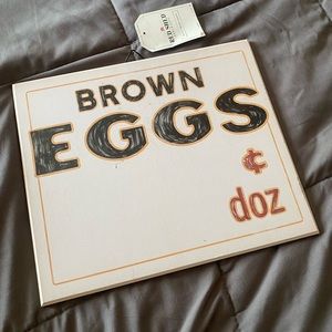 Red shed advertise brown eggs sign